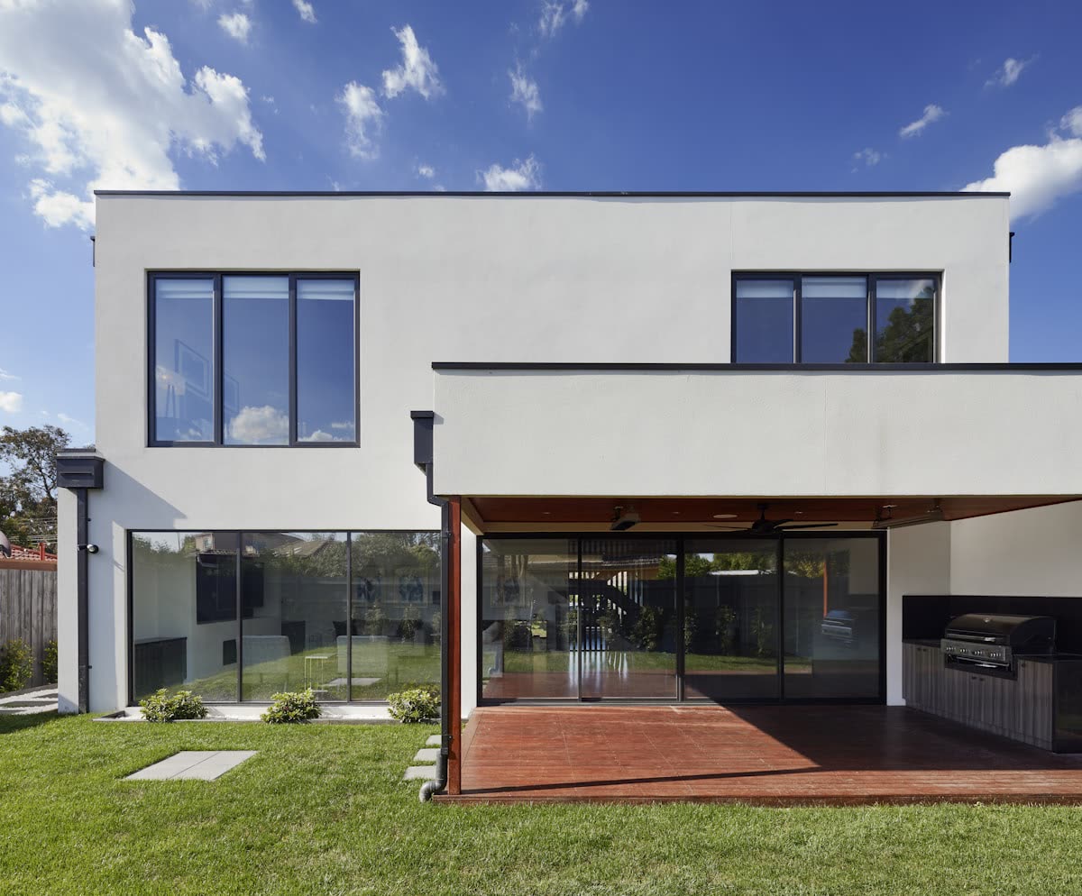 Photo: Finished house, street view with boundary wall and gate